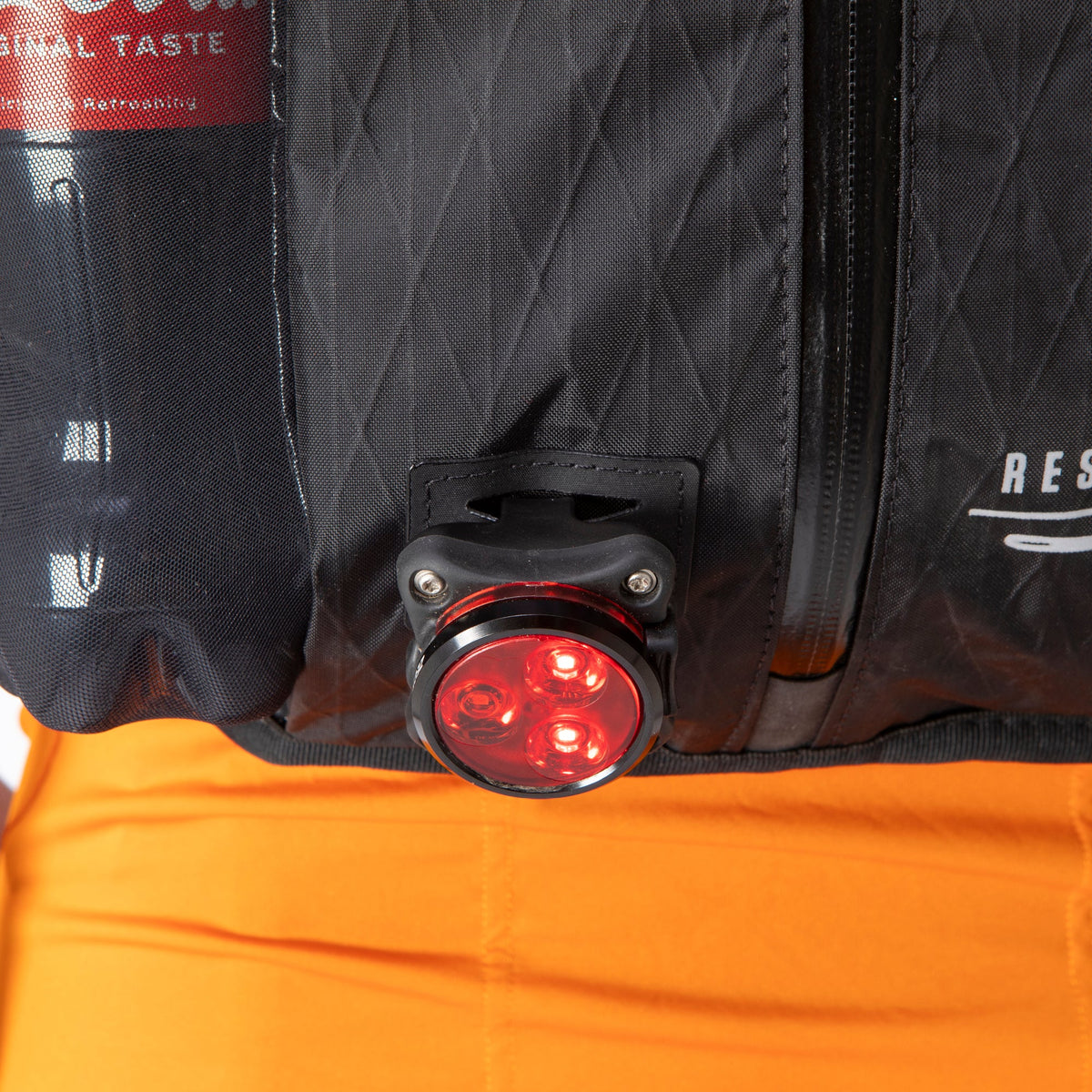 Restrap Race Hydration Vest light loop with a light attached